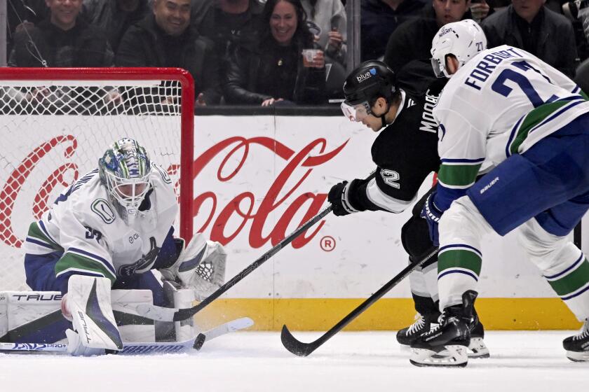Conor Garland scores in overtime to lift Canucks over the Kings