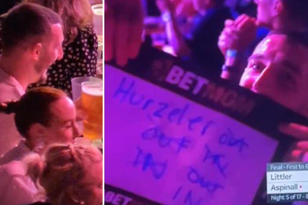 England star spotted at darts in Luke Littler shirt holding up bizarre message to his Premier League manager